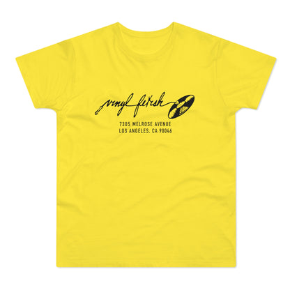 Yellow t-shirt with black "vinyl fetish" text and address details.