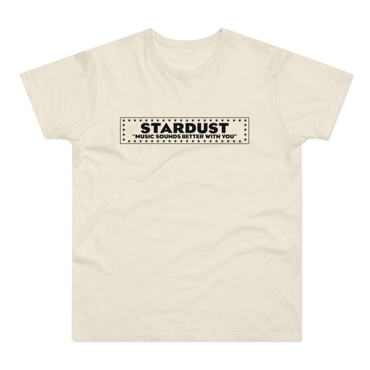 A cream-colored short-sleeved t-shirt features a black rectangular graphic on the chest with the text STARDUST and MUSIC SOUNDS BETTER WITH YOU surrounded by a border of stars.