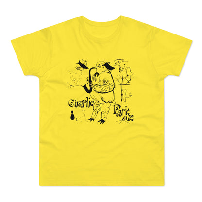 Yellow t-shirt with black cartoon bird playing saxophone and "Charlie Parker" text.