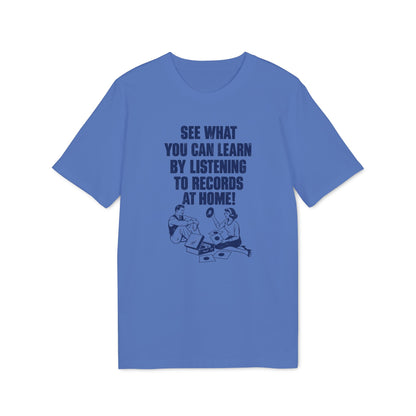 A blue short-sleeve t-shirt with a vintage graphic and text reading "SEE WHAT YOU CAN LEARN BY LISTENING TO RECORDS AT HOME!"