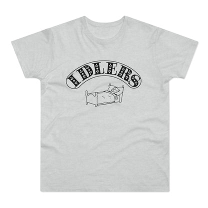 T-shirt with "IDLERS" text above a person in bed.