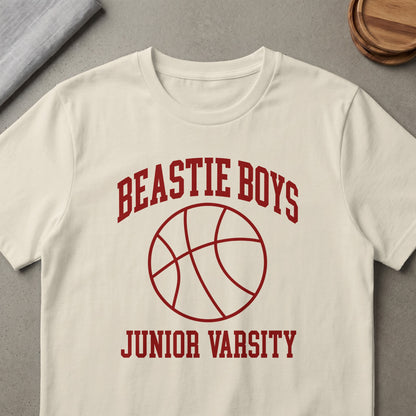Cream t-shirt with red "Beastie Boys Junior Varsity" text and basketball graphic.