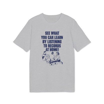 A grey t-shirt featuring blue text that reads "SEE WHAT YOU CAN LEARN BY LISTENING TO RECORDS AT HOME!" above a vintage illustration of a man and woman listening to vinyl records.