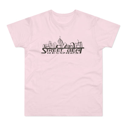 A light pink t-shirt featuring a black graphic of a stylized city skyline and the text Street Beat Records.