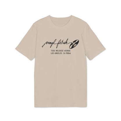 Tan t-shirt with "vinyl fetish" logo and address 7305 MELROSE AVENUE LOS ANGELES, CA 90046.