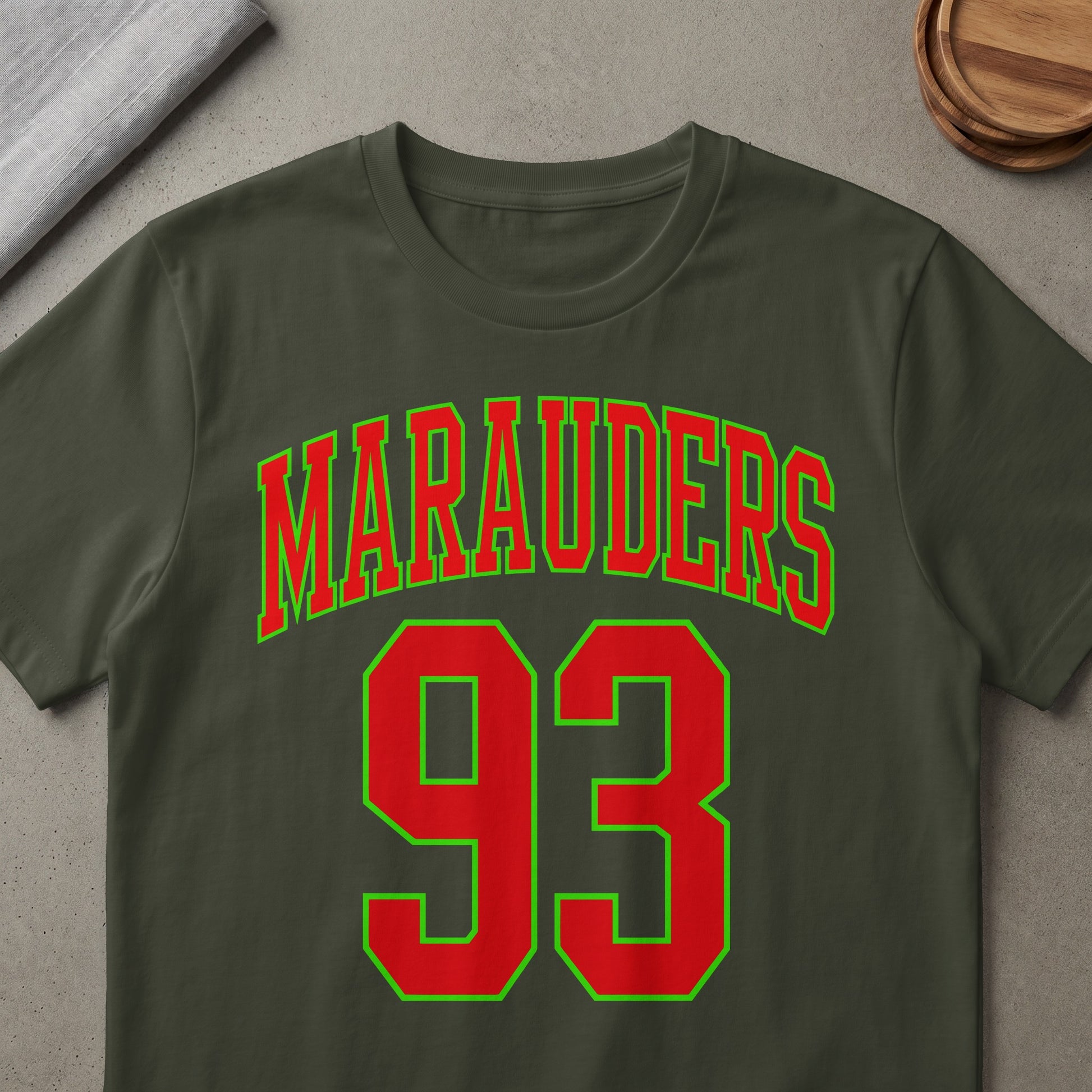 Olive green t-shirt with "Marauders 93" text in red and lime green.