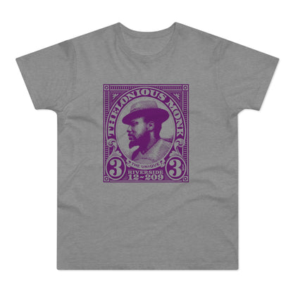 Thelonious Monk portrait within a purple stamp design on a gray t-shirt.