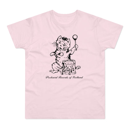 Black and white drawing of a cat with drumsticks and a drum on a pink t-shirt.