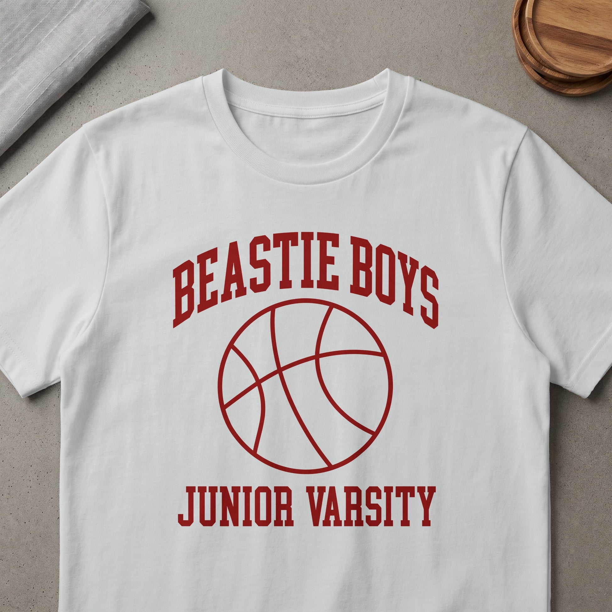 White t-shirt with red "BEASTIE BOYS JUNIOR VARSITY" text and basketball graphic.