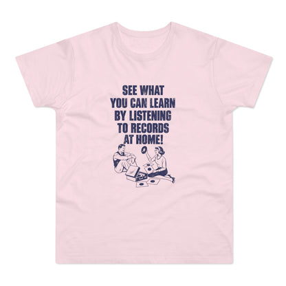 Light pink short-sleeve t-shirt with retro blue graphic text reading See What You Can Learn by Listening to Records at Home! above vintage illustrations of a man and woman with records.