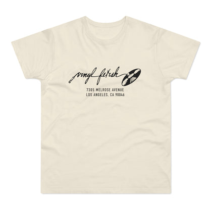 Cream t-shirt with black text and vinyl record graphic, 7305 Melrose Ave Los Angeles
