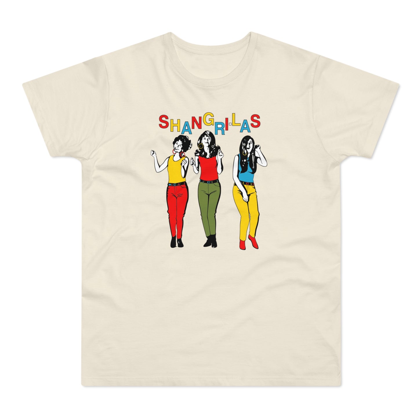 Three women in colorful outfits stand beneath the word "SHANGRI-LAS" on a cream t-shirt.