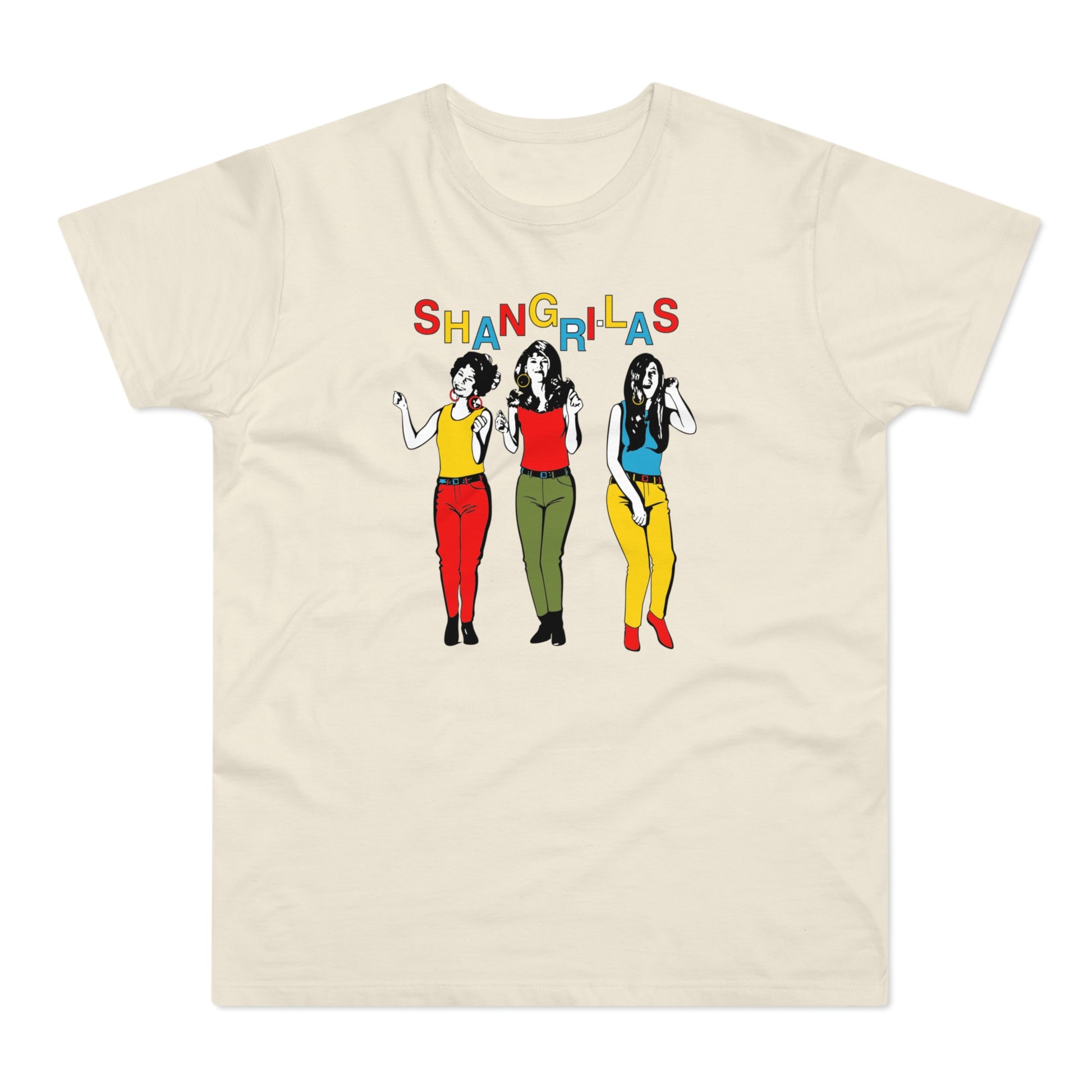 Three women in colorful outfits stand beneath the word "SHANGRI-LAS" on a cream t-shirt.