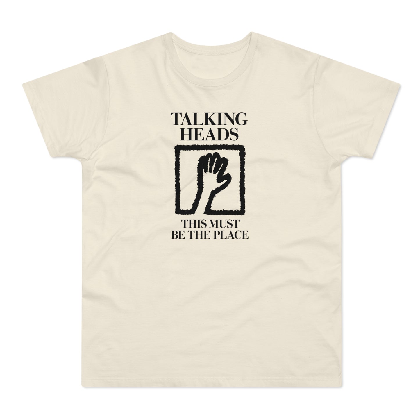 Cream t-shirt with black "Talking Heads" text, hand icon, and "This Must Be The Place" text.
