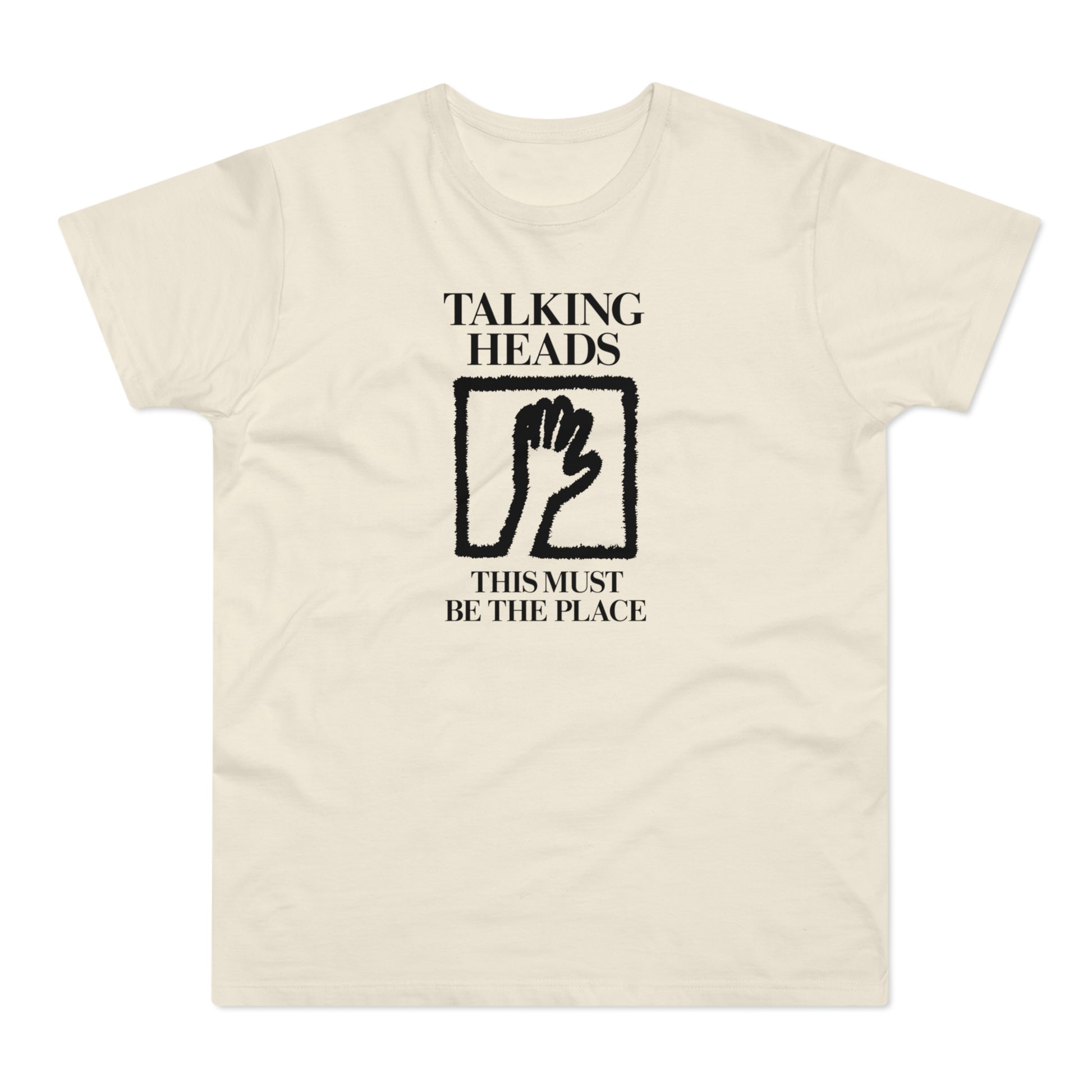 Cream t-shirt with black "Talking Heads" text, hand icon, and "This Must Be The Place" text.