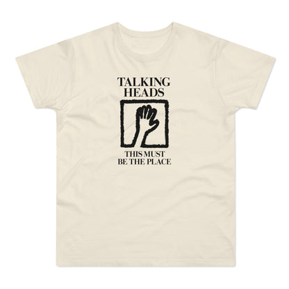 Cream t-shirt with black "Talking Heads" text, hand icon, and "This Must Be The Place" text.