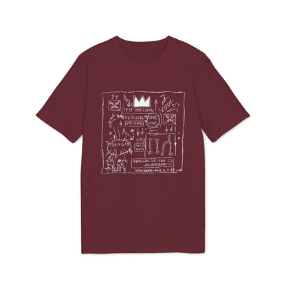 Maroon t-shirt featuring a white graphic print with graffiti-style text, arrows, and a crown.
