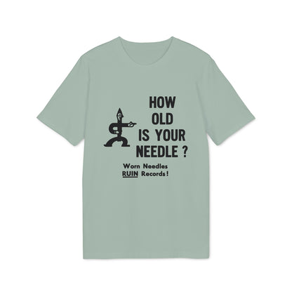Light green t-shirt with black text and illustration asking "HOW OLD IS YOUR NEEDLE?"
