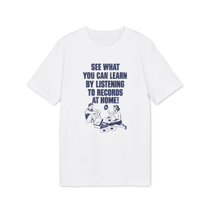 White short-sleeved t-shirt with blue text reading "SEE WHAT YOU CAN LEARN BY LISTENING TO RECORDS AT HOME!" above an illustration of a man and woman listening to a record player.
