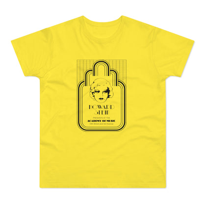 Yellow t-shirt with black graphic of a woman's face and "HOWARD STEIN" text.